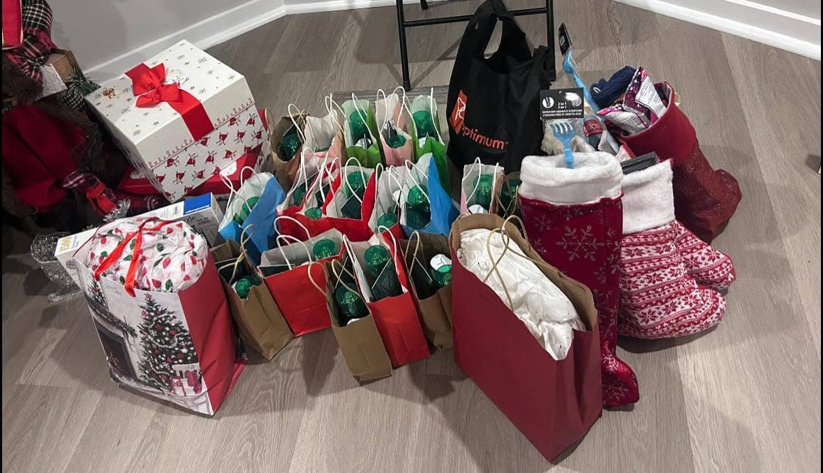 Tables of gifts and goodies staged before stuffing the stockings
